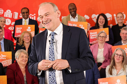 Ed Davey Ed Davey with a child on his shoulders